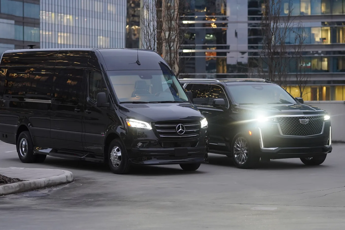 Mercedes-Benz Sprinter beside a Cadillac Escalade ESV