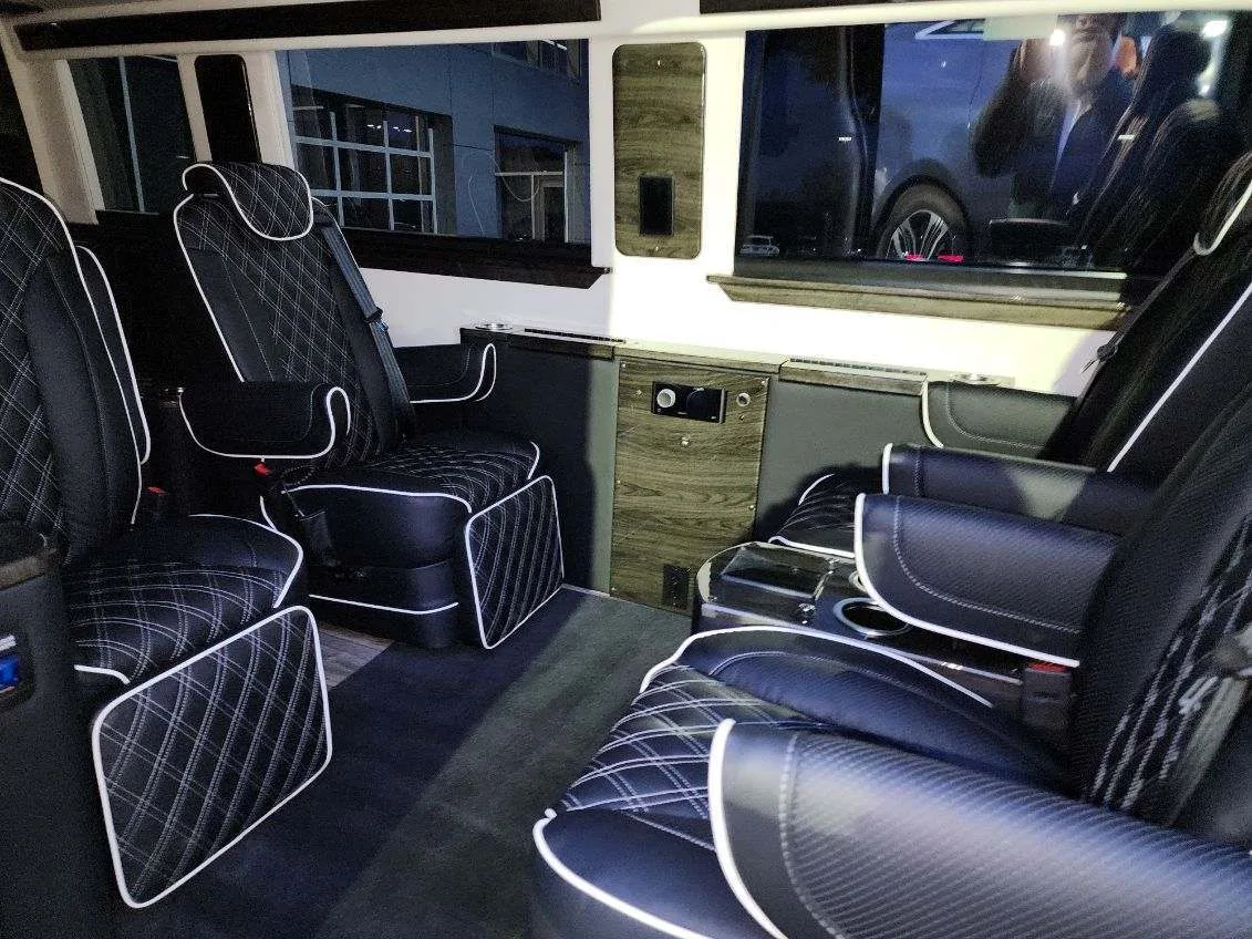 Mercedes-Benz Sprinter lounge seating with wood-grain trim